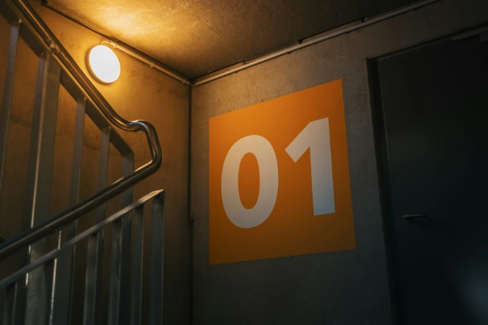 a stairwell with a sign that reads 10 on it